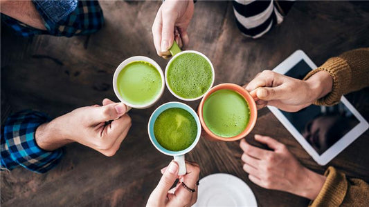 four people enjoying warm matcha tea together